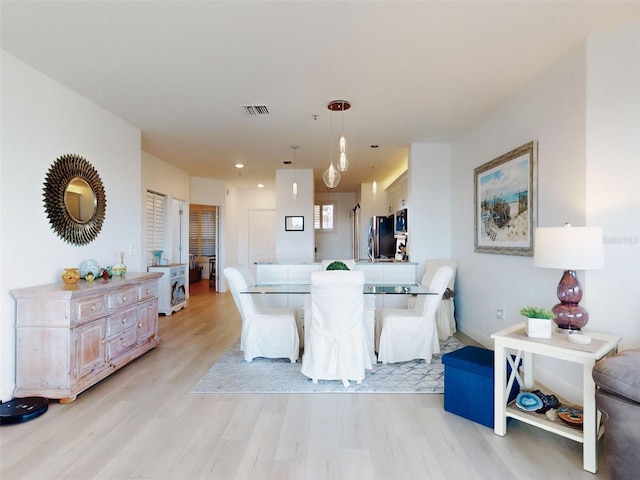 dining room with light wood-type flooring