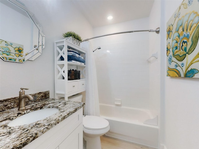 full bathroom featuring vanity, hardwood / wood-style floors, toilet, and shower / bath combo with shower curtain