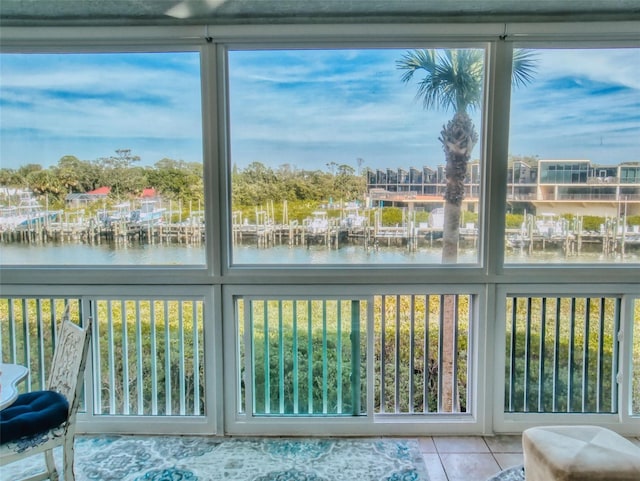 unfurnished sunroom with a water view