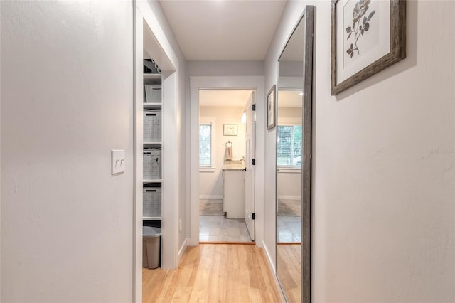 hallway featuring light wood-type flooring