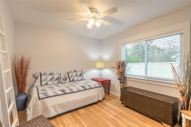 bedroom featuring light hardwood / wood-style floors and ceiling fan