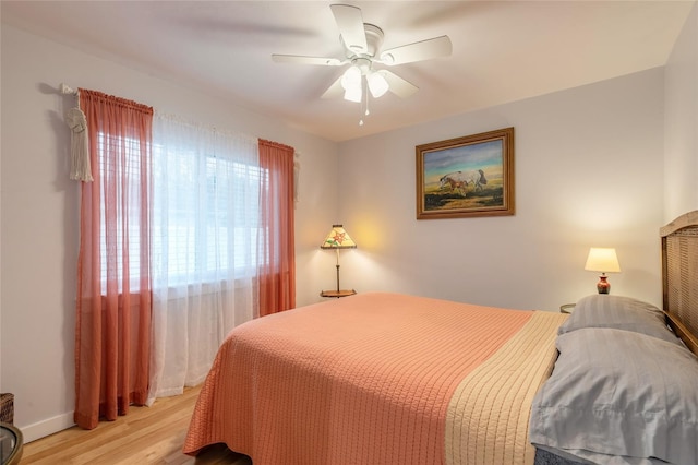 bedroom featuring ceiling fan and light hardwood / wood-style flooring