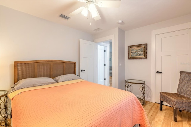 bedroom with ceiling fan and light wood-type flooring