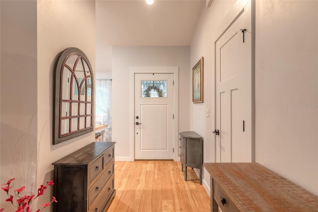 foyer entrance with light wood-type flooring