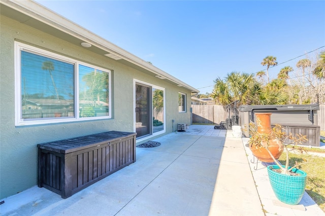 view of patio / terrace featuring a hot tub