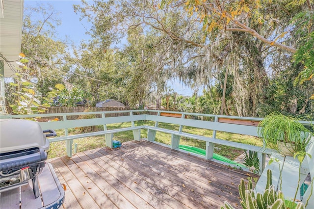 wooden terrace with area for grilling