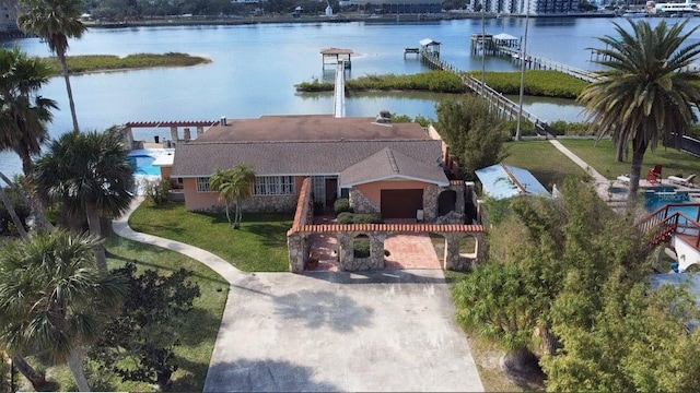 drone / aerial view with a water view