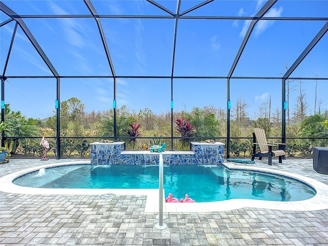 view of pool featuring a lanai, a patio area, and pool water feature