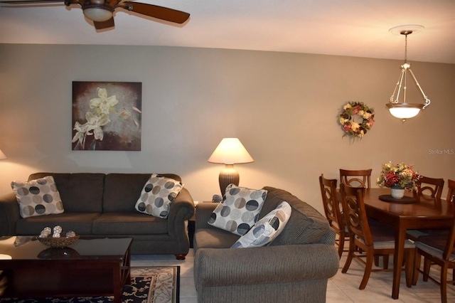 living room featuring light tile patterned floors and ceiling fan