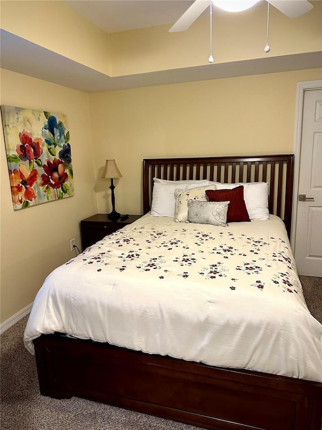 bedroom with ceiling fan and carpet floors