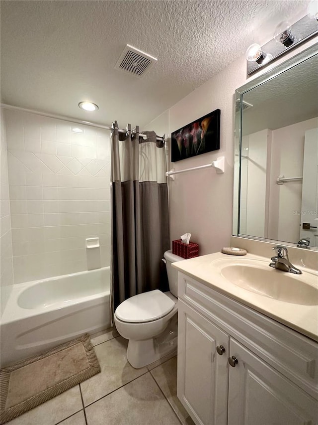 full bathroom with vanity, toilet, shower / bath combo, tile patterned floors, and a textured ceiling