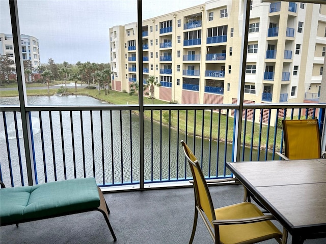 balcony featuring a water view