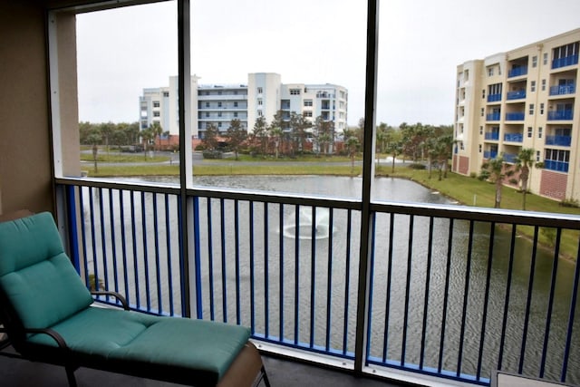 balcony featuring a water view