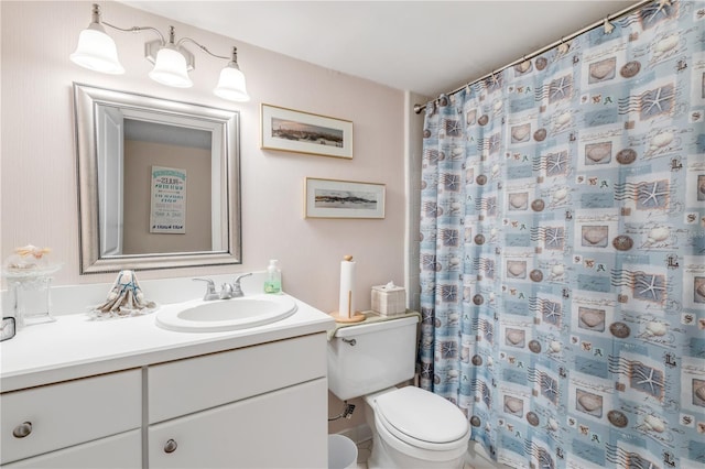 bathroom with walk in shower, vanity, and toilet