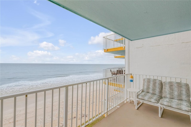 balcony with a view of the beach and a water view