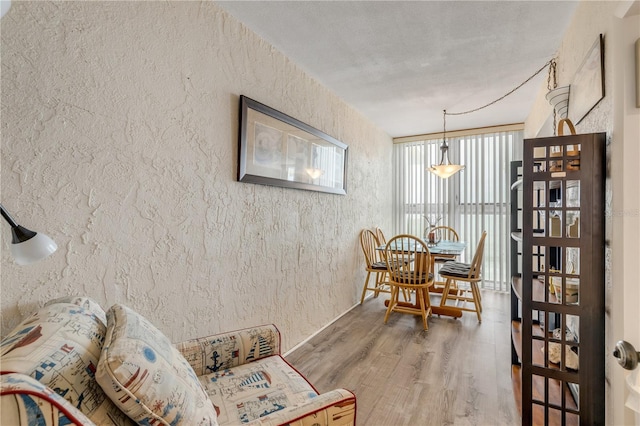 dining space with hardwood / wood-style flooring