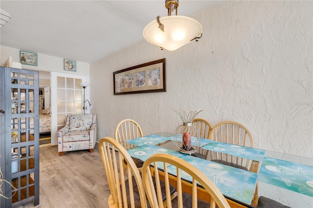 dining area featuring wood-type flooring