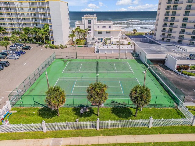 view of sport court with a water view