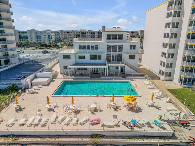 view of swimming pool with a patio