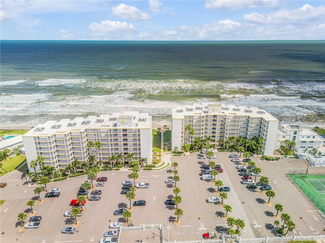 drone / aerial view with a view of the beach and a water view