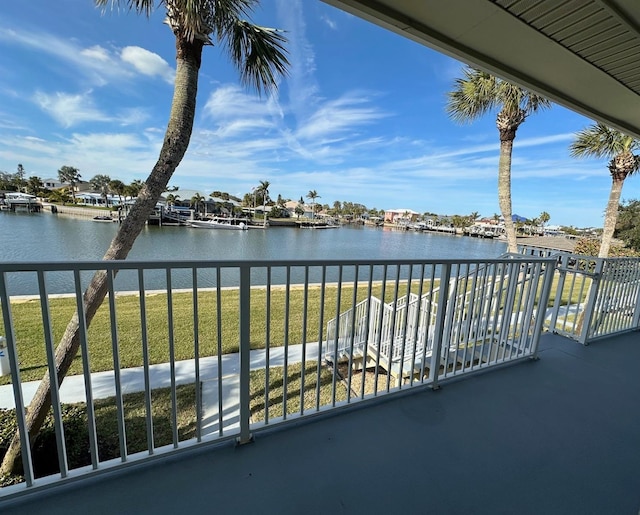 balcony featuring a water view