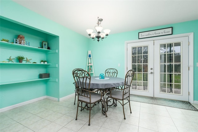 dining room featuring plenty of natural light, an inviting chandelier, and french doors