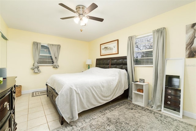 tiled bedroom with ceiling fan