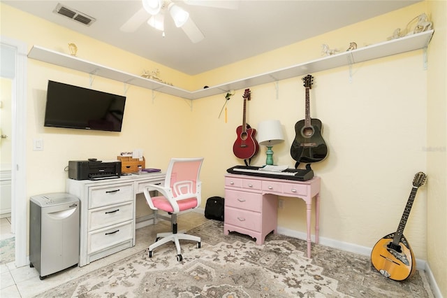 office with light tile patterned floors and ceiling fan