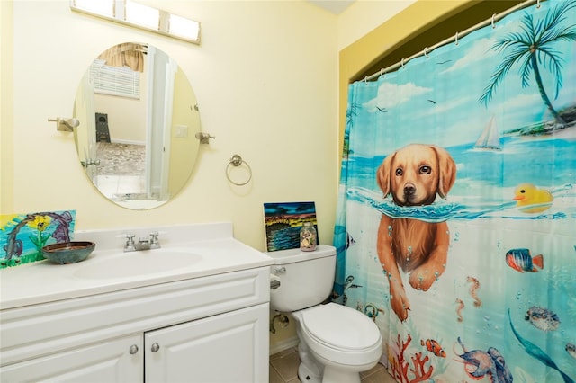 bathroom with vanity, toilet, tile patterned flooring, and a shower with shower curtain