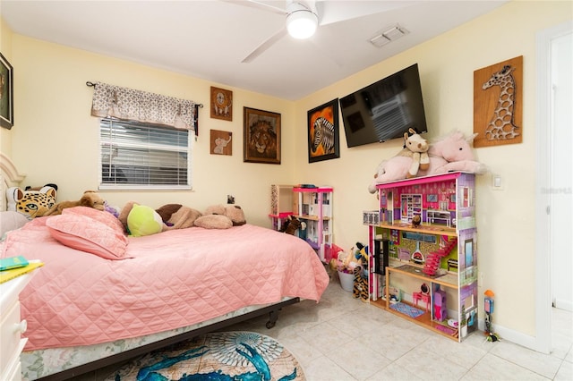 tiled bedroom featuring ceiling fan