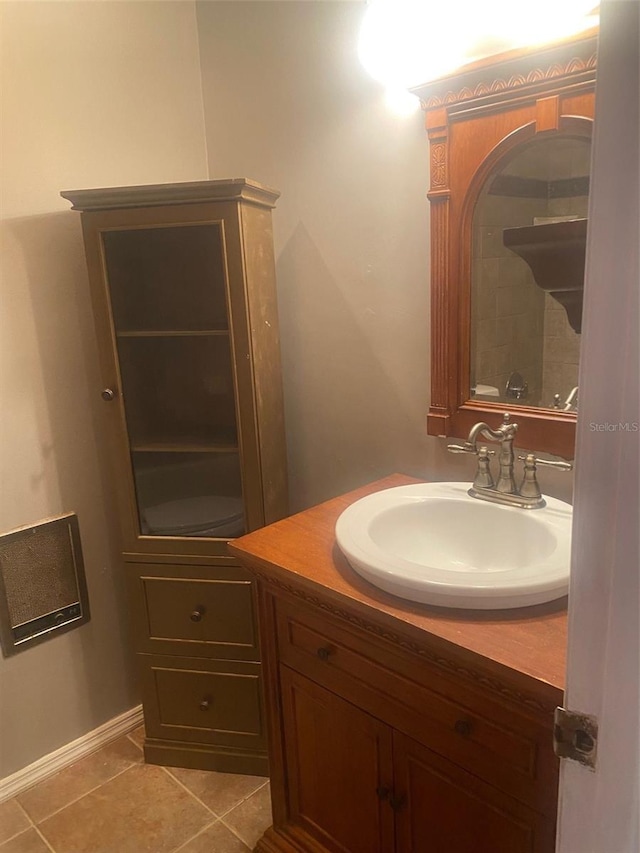 bathroom with vanity, toilet, and tile patterned flooring