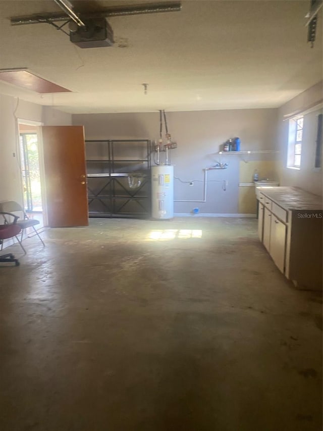 garage featuring a garage door opener and electric water heater