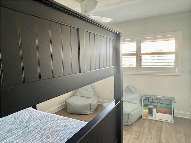 bedroom featuring ceiling fan and light hardwood / wood-style floors