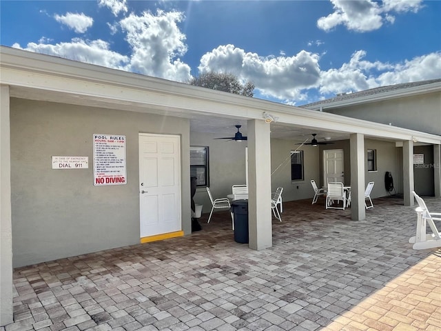 view of patio featuring ceiling fan