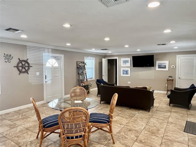 dining area featuring crown molding