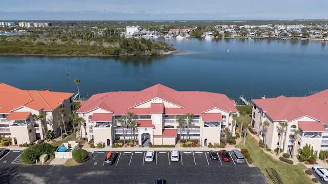 birds eye view of property with a water view