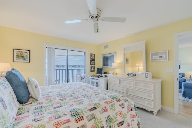 bedroom featuring light carpet, access to outside, and ceiling fan