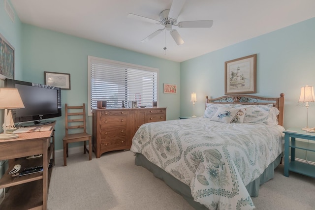 bedroom featuring ceiling fan and light carpet