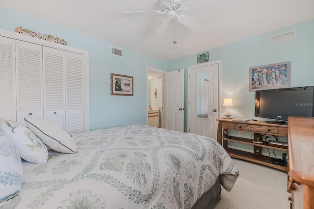 carpeted bedroom featuring ceiling fan and a closet