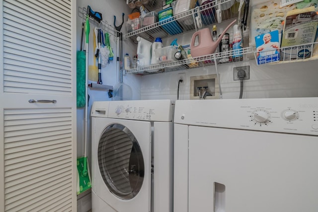 washroom featuring washer and dryer