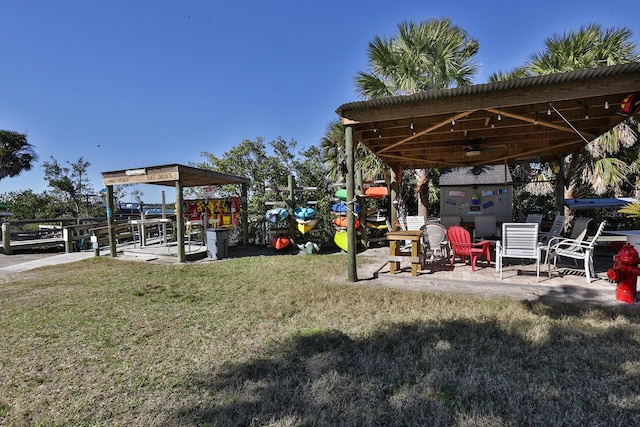 view of yard with ceiling fan