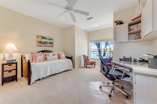 bedroom featuring ceiling fan and light carpet