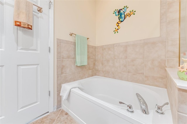 bathroom with a bathing tub and tile walls