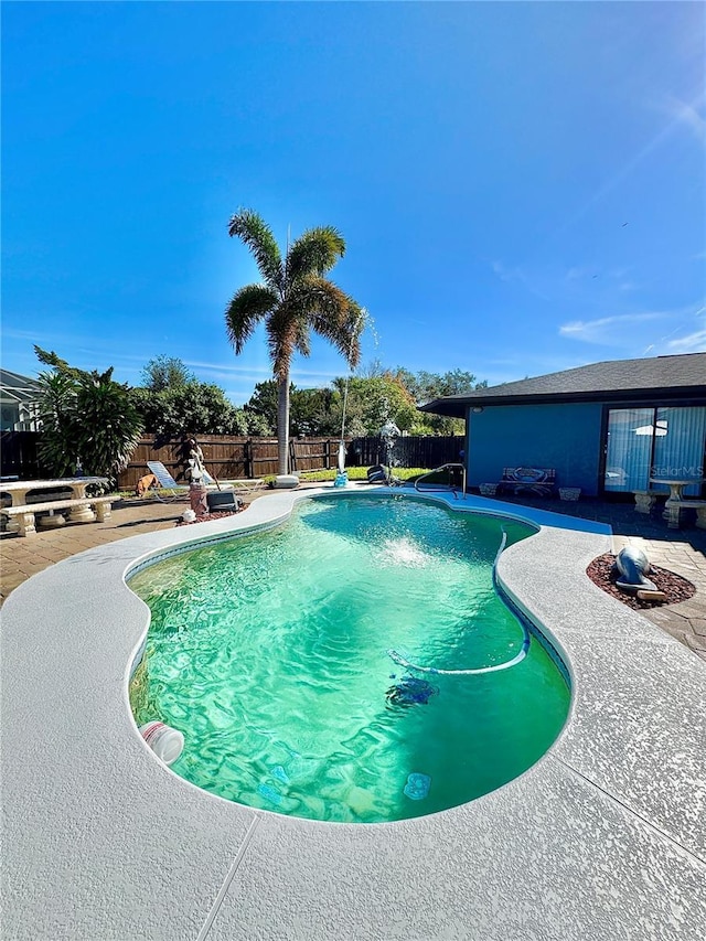 view of pool featuring a patio area