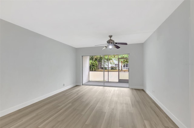 empty room featuring ceiling fan and light hardwood / wood-style flooring