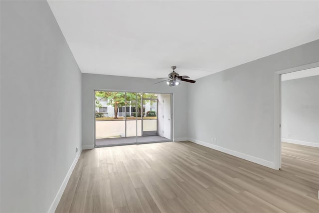 unfurnished room featuring ceiling fan and light wood-type flooring