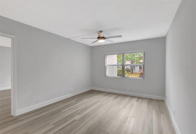 spare room with ceiling fan and light hardwood / wood-style flooring