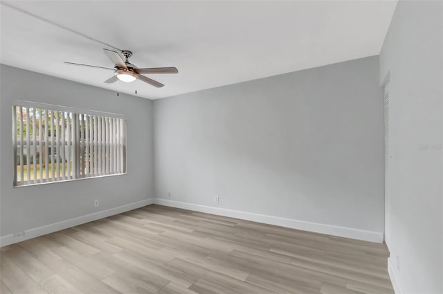 unfurnished room featuring ceiling fan and light wood-type flooring