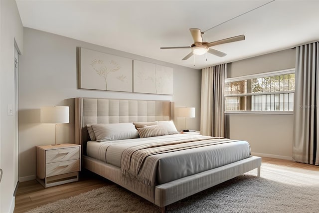 bedroom featuring dark hardwood / wood-style floors and ceiling fan