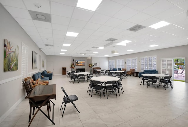 dining area featuring a paneled ceiling